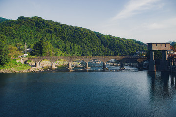 Old stone bridge seen from the street of the country
