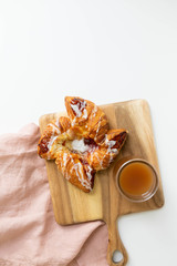 Strawberry and Sweet Cheese Danish with Icing Drizzle on Wooden Serving Board with Hot Coffee, Fruit Pastry Flat Lay