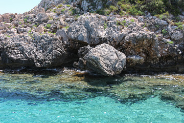 Naklejka na ściany i meble The spectacle of the crystalline sea arrived in the beautiful Cala Luna in the Gulf of Orosei in Sardinia.