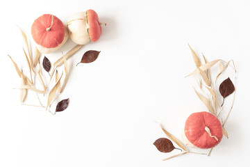 Autumn minilal composition. Frame made of autumn colourful leaves and pumpkins . Flat lay, top view, copy space. Autumn fall nature season background