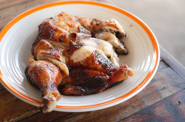 Grilled chicken in white plate.Thai street food.