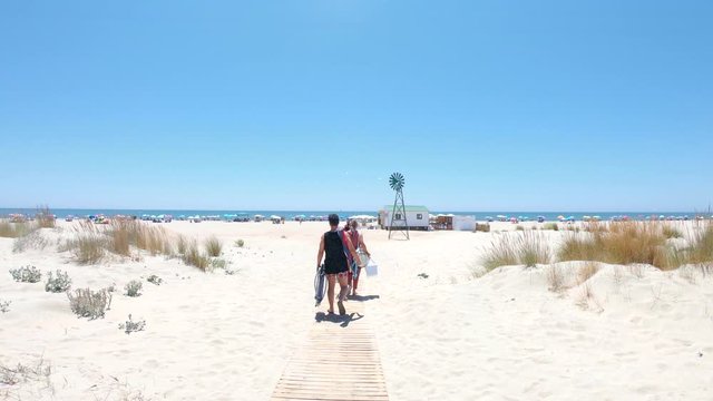 View of People accessing to Punta Umbria Beach in Huelva, Spain