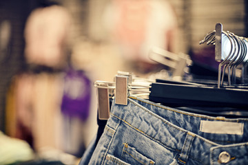 Fototapeta na wymiar Jeans on the hanger in the store.