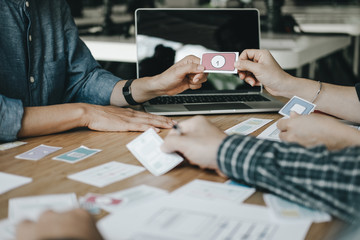 Graphic designers work together with computer designing application for mobile phone, Graphic designers concept