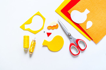 Yellow felt bird workshop. Materials for creativity with children.