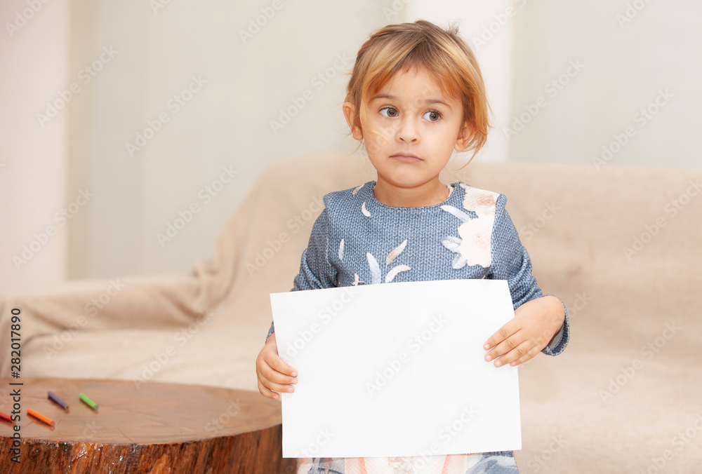 Wall mural happy girl with white sheet in hands