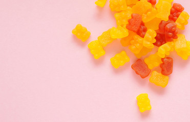 Gummy bear vitamin on colorful background.