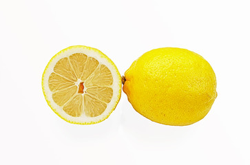One whole and half of yellow ripe lemon fruit