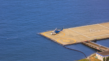 Single Helicopter on helipad in Vancouver