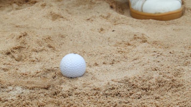 Slow Motion Hitting the golf ball out of the sand