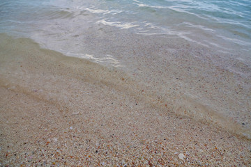 transparent ocean waves and sand