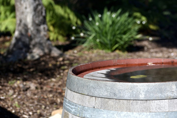 weathered wooden barrel at garden