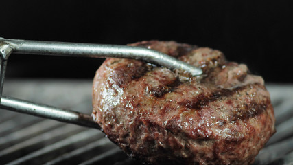 Organic burger cutlet cooked on the grill. concept of nature and creation of natural products