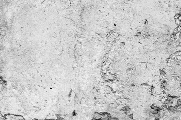 Texture of a concrete wall with cracks and scratches which can be used as a background