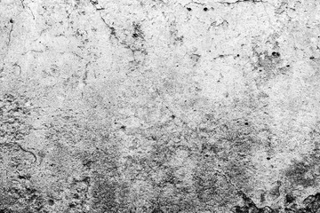 Texture of a concrete wall with cracks and scratches which can be used as a background