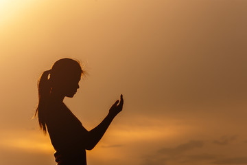 silhouette girl praying