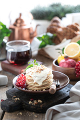 Sweet pancakes with currant berries and sauce