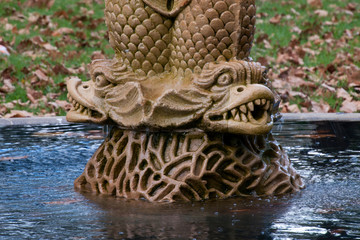 Sydney Australia,  Close-up of carp at the base of John Baptist Fountain a mid-19th century Australian garden fountain. The oldest locally made ornamental fountain in NSW.