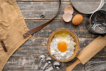 Baking or cooking background frame. Ingredients, kitchen items for baking cakes. Kitchen utensils, flour, eggs,  .Text space, top view.