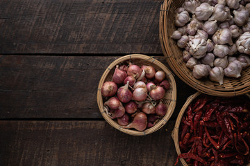 Composition of Thai chili paste and curry on a wooden table, top view and space for text