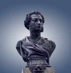 Bronze bust of Alexander Pushkin, isolated on gray background. Monument of great russian poet in...