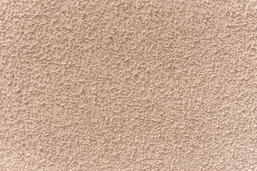 Abstract light brown cement wall textured background, seamless tiling texture