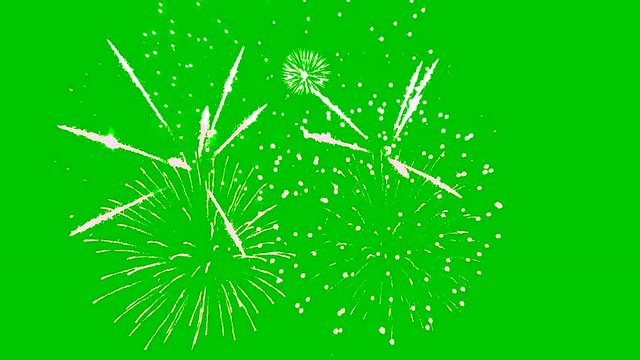 Fireworks isolated on green background. Festive sparkling lights and flashes of firework.