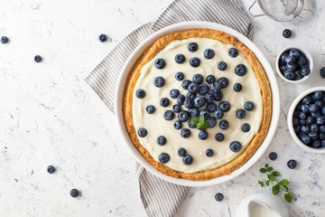 Blueberry tart with whipped cream