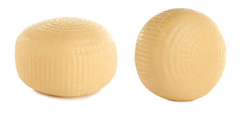 Wheels of delicious cheese on white background