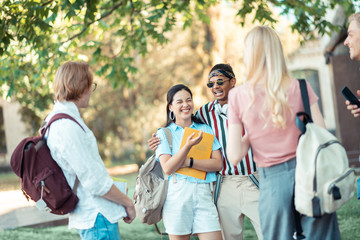 Group of students laughing at their jokes.