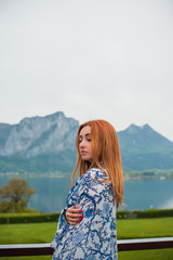 Tourism concept. Beautiful woman look at lake. Vacation in Salzburg 