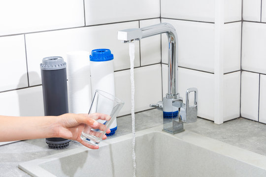 Replacing the water filter. Ecology. Clean water.