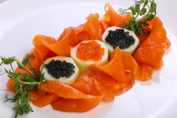 Sliced salmon with caviar