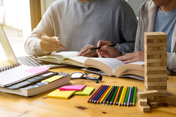 Students helps friend teaching and learning subject additional in library. Education concept.