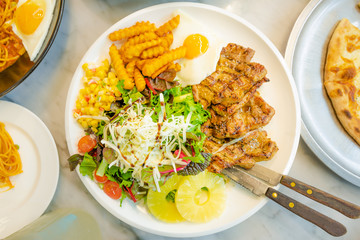 Pork, Salad, Pineapple, and French fries