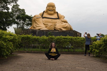 Meditating at the foot of the smiling Buddha 03