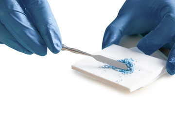 Pediatric dentistry, colored dental filling for children close-up on a white background. Mixing filling color material for teeth. Place for text.