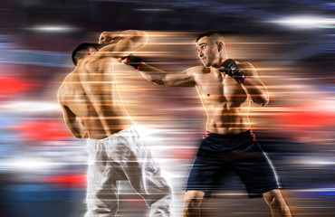 MMA boxers fighters fight in fights without rules. Blurred effect