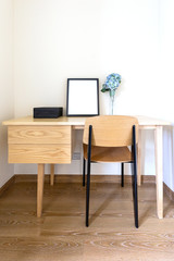 The mock up photo frame on wooden shelf  Concept of minimalist shelfie.