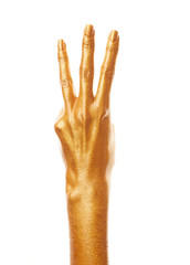 Hands in gold paint. Golden fingers. Female hand is showing numbers isolated on white background. Sign language. Hand numbers