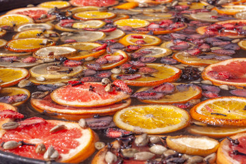 background of a large number of citrus and berry compote