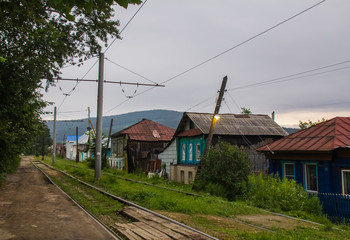 Fototapeta na wymiar Village area of the city through which tram traffic passes, Zlatoust