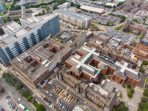 Aerial photo of the St. James's University Hospital in Leeds, West Yorkshire, England, showing the Hospital, A&E entrance and grounds and also the Leeds City Centre in the background on a sunny day.
