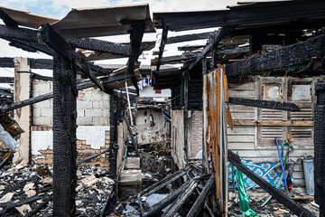 The crowded old wooden houses is on fire, Conflagration, The ruins of a fire