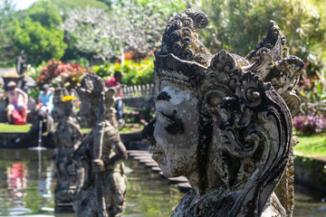  sculptures of a temple on water in bali