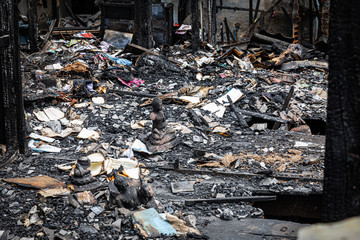 The crowded old wooden houses is on fire, Conflagration, The ruins of a fire