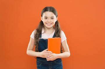 Ready for first lesson. September is here. Back to school. Child hold book. Interesting literature. Development and education. Child care and happy childhood. Study at school. First day at school