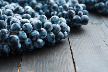 red grape on black wooden table