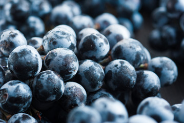 red grape on black wooden table