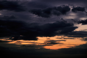 Beautiful sunset - dark sky with clouds and sunlight